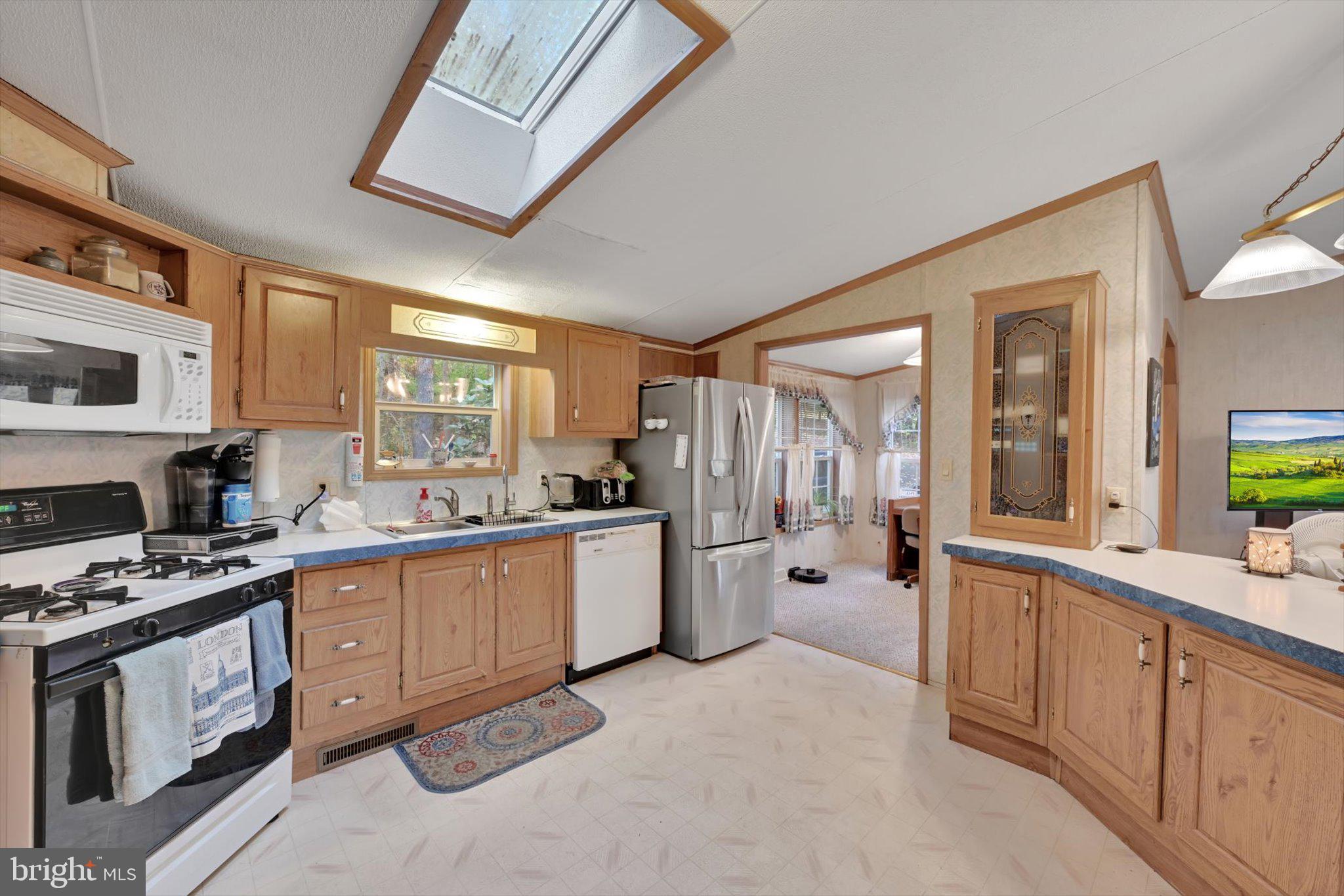 1104 Bedford Avenue Reading, PA 19607 - Photo 14 of 39 a large kitchen with stainless steel appliances granite countertop a stove a sink dishwasher and a refrigerator