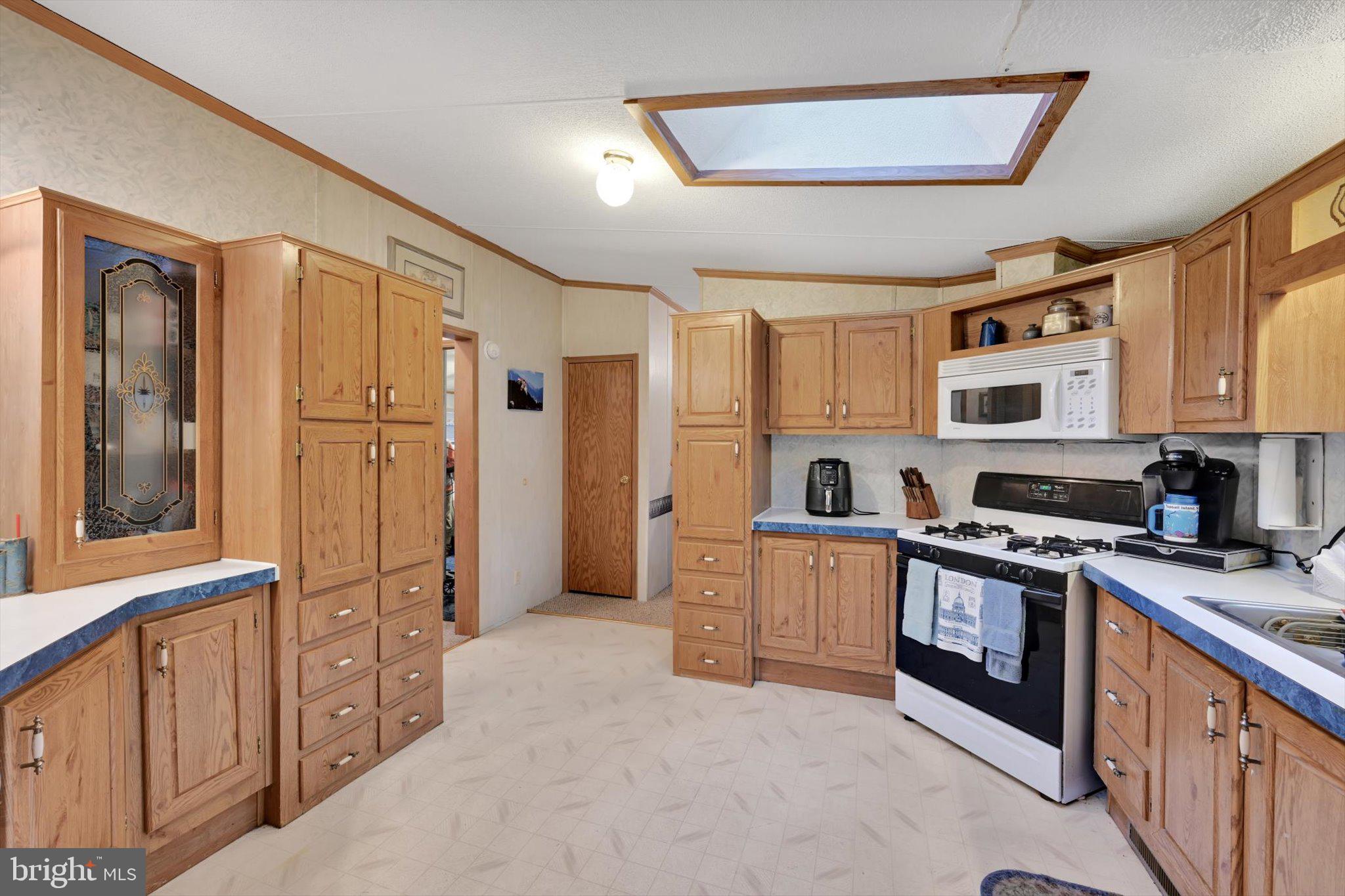 1104 Bedford Avenue Reading, PA 19607 - Photo 16 of 39 a kitchen with stainless steel appliances granite countertop a refrigerator a stove top oven a sink and dishwasher