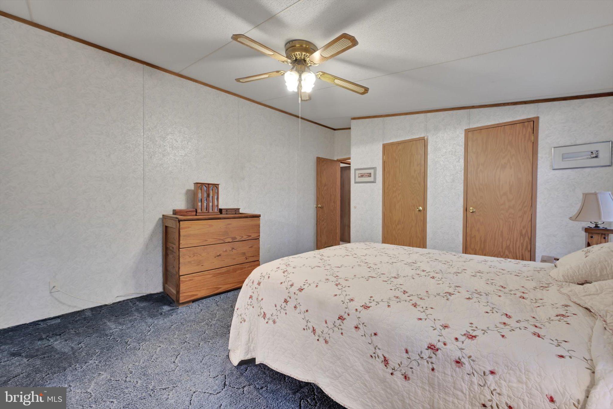 1104 Bedford Avenue Reading, PA 19607 - Photo 21 of 39 a bedroom with a bed and a chandelier