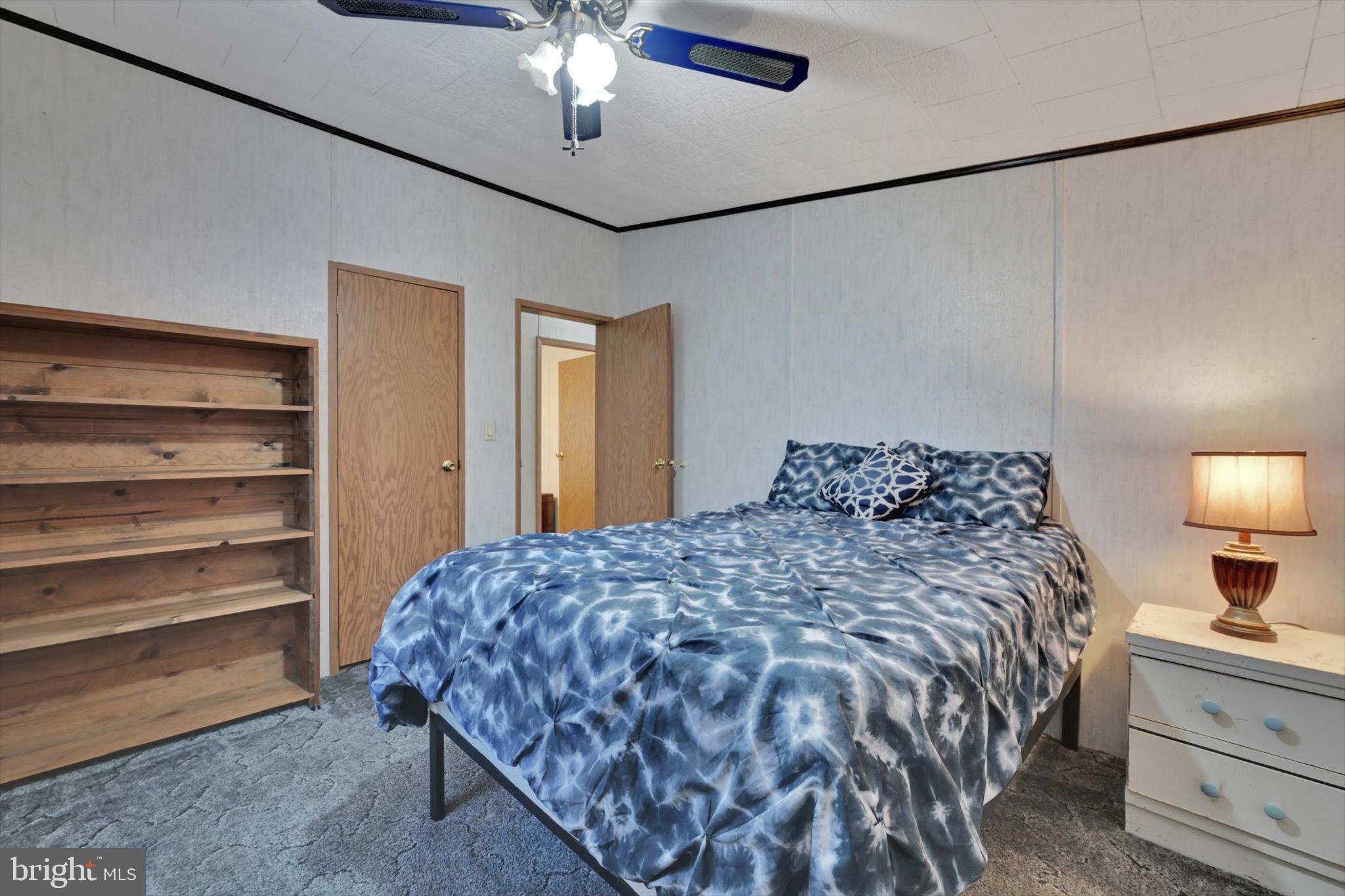 1104 Bedford Avenue Reading, PA 19607 - Photo 25 of 39 a bedroom with a bed and a chandelier