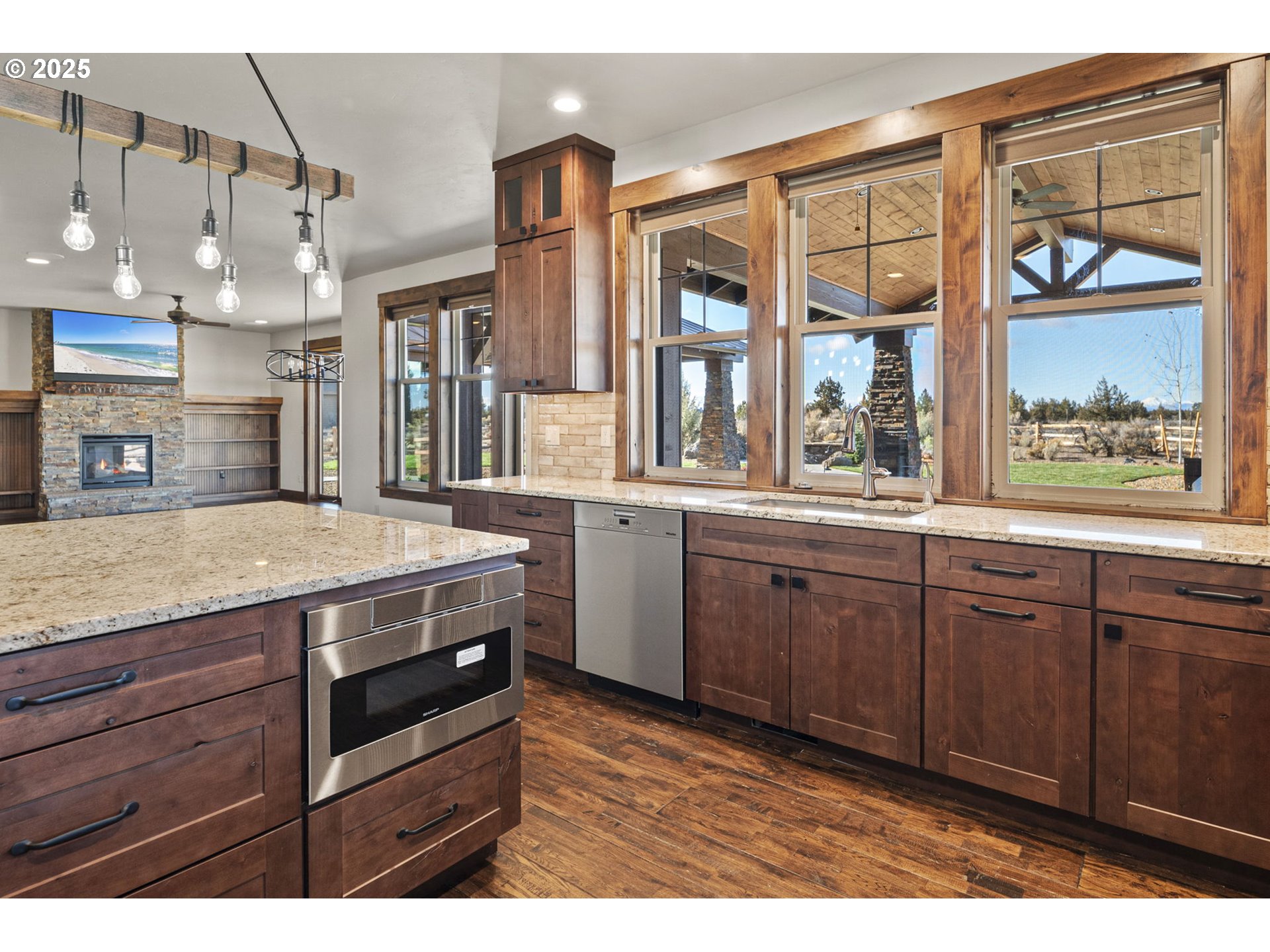 16660 Southwest Ranchview Court Powell Butte, OR 97753 - Photo 11 of 32 a kitchen with a stove a sink and a window