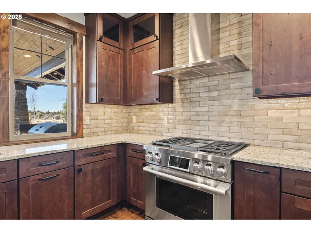 a kitchen with cabinets and appliances
