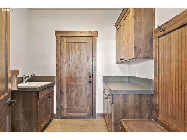 a bathroom with a sink a mirror and a shower