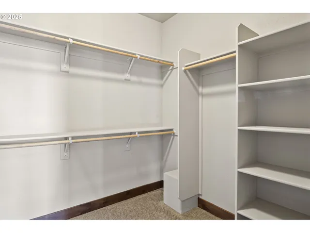 a view of an empty walk in closet