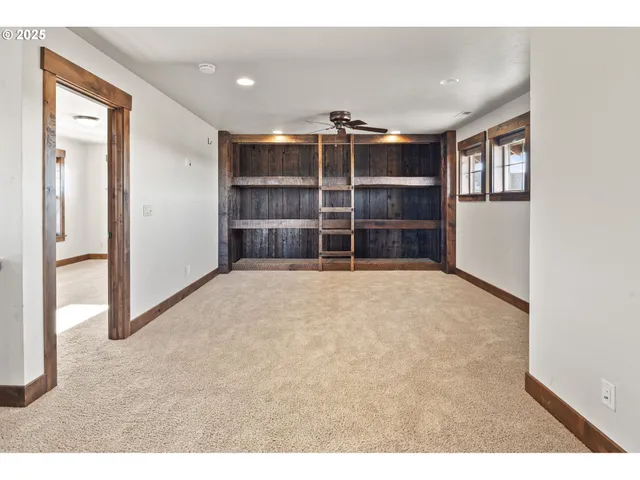 a view of an empty room with a cabinet