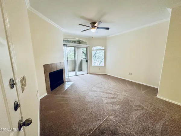 a view of livingroom with hardwood floor and a ceiling fan