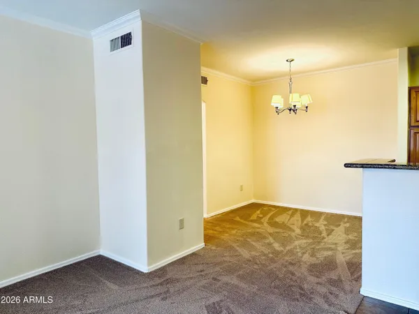 a view of empty room with a fireplace