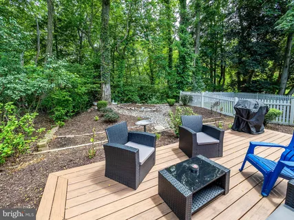 a view of backyard with outdoor seating
