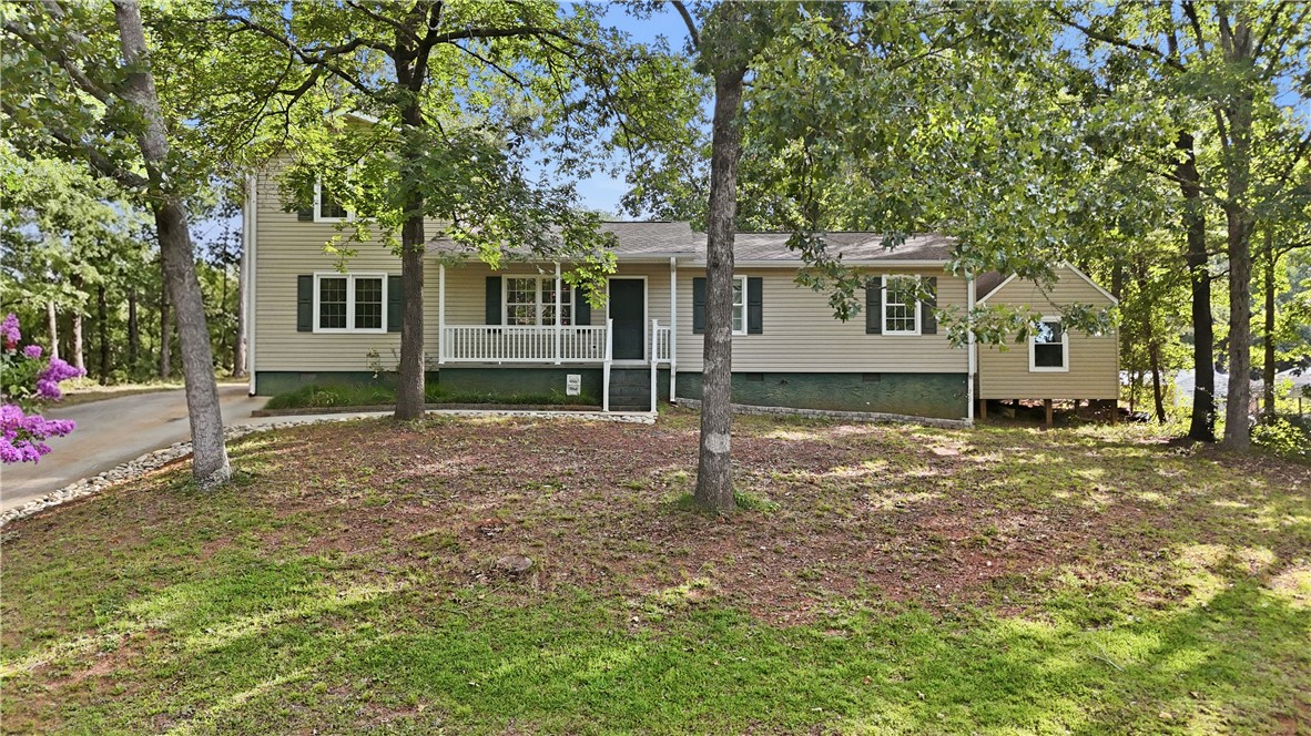 2001 Ridgeview Lane Seneca, SC 29678 - Photo 1 of 27 A charming residence surrounded by mature trees, offering a serene, private setting.