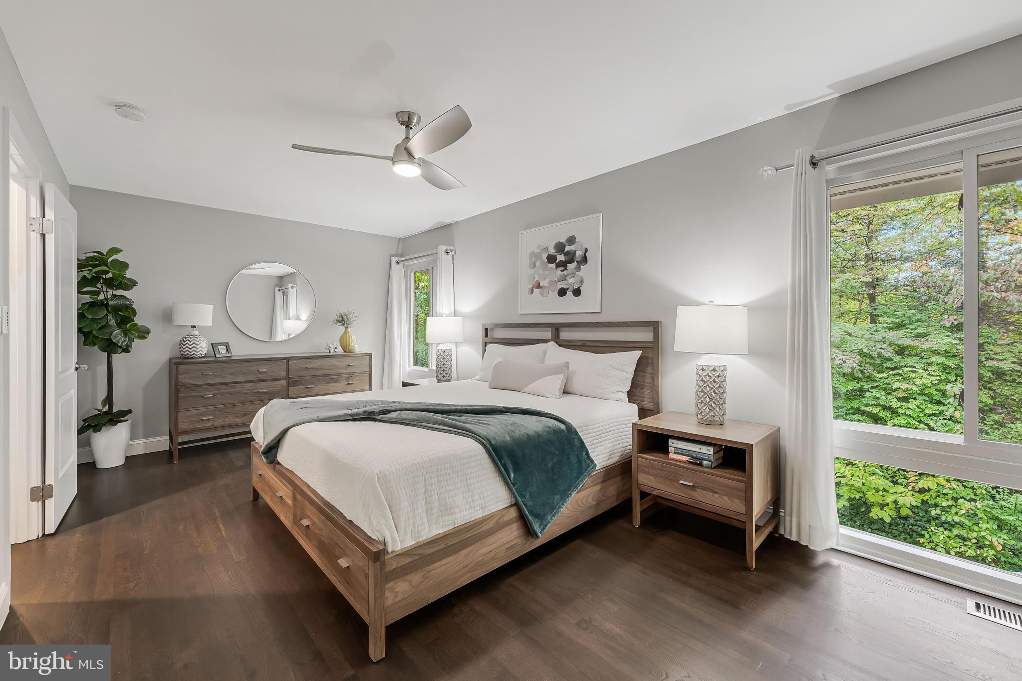 1775 Wainwright Drive Reston, VA 20190 - Photo 14 of 44 Large windows bring the beautiful nature views
