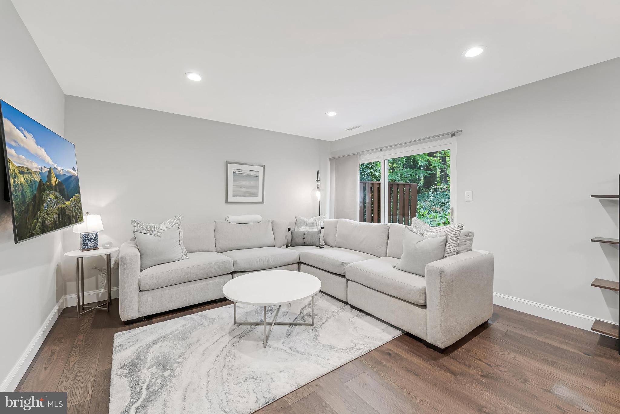 1775 Wainwright Drive Reston, VA 20190 - Photo 7 of 44 Cozy living room opens to private deck
