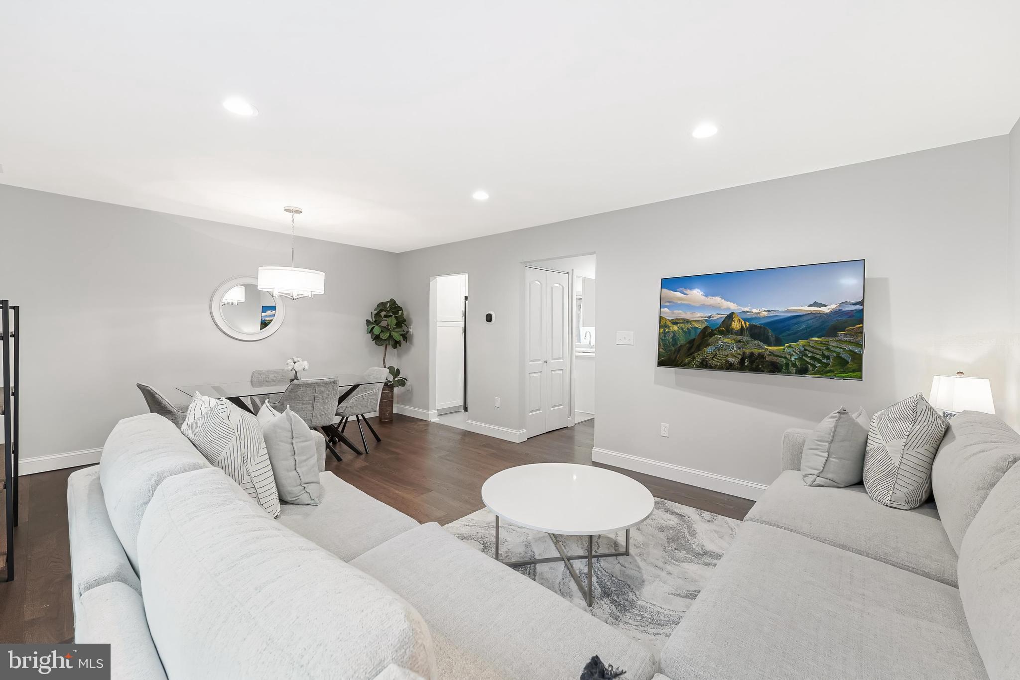 1775 Wainwright Drive Reston, VA 20190 - Photo 9 of 44 Living Room TV Conveys