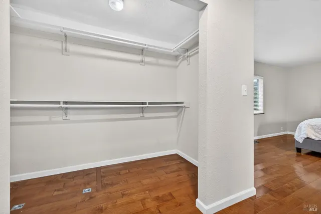 a view of a house with backyard and a tree