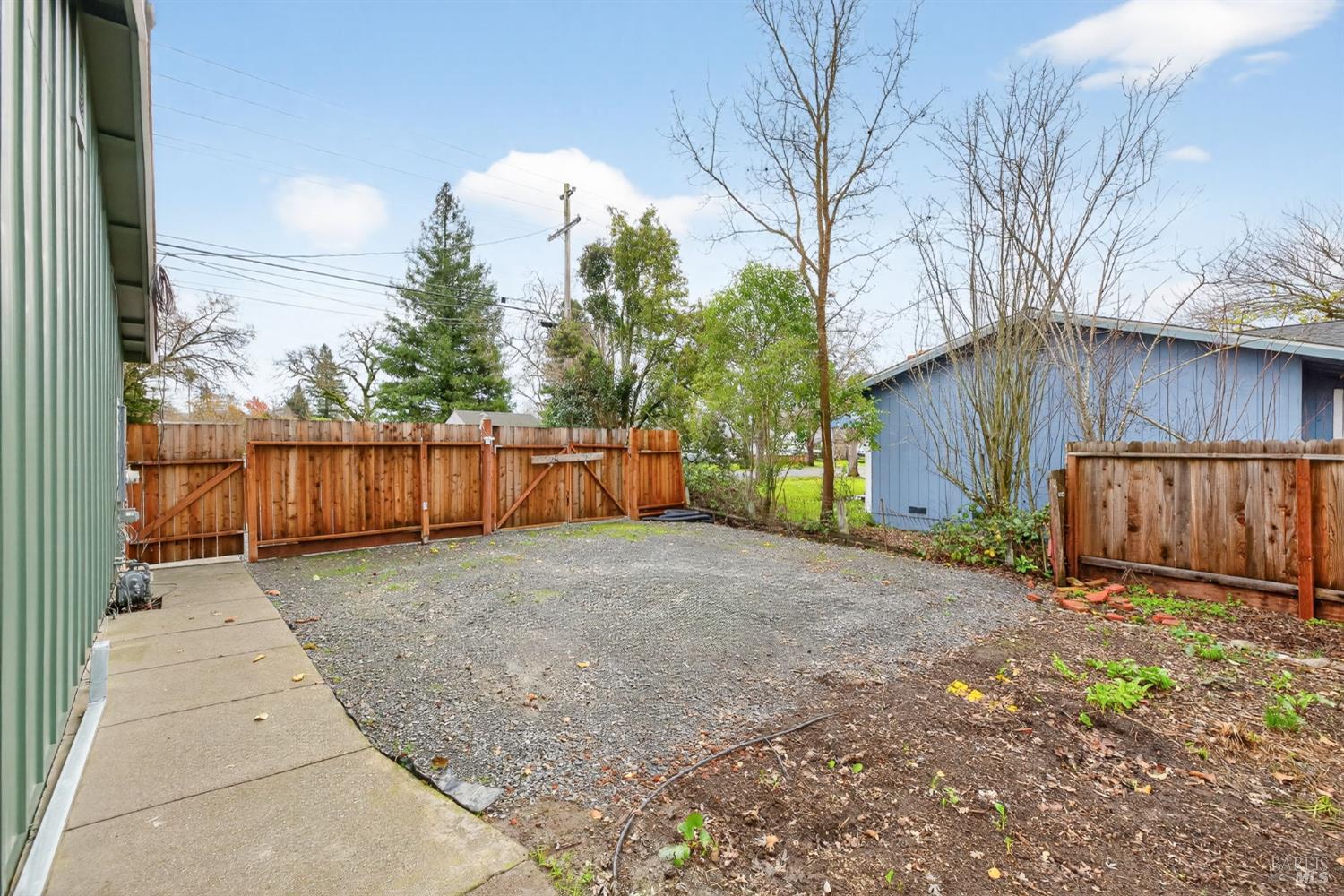 4933 Hansen Drive Santa Rosa, CA 95409 - Photo 40 of 58 a view of backyard and wooden fence