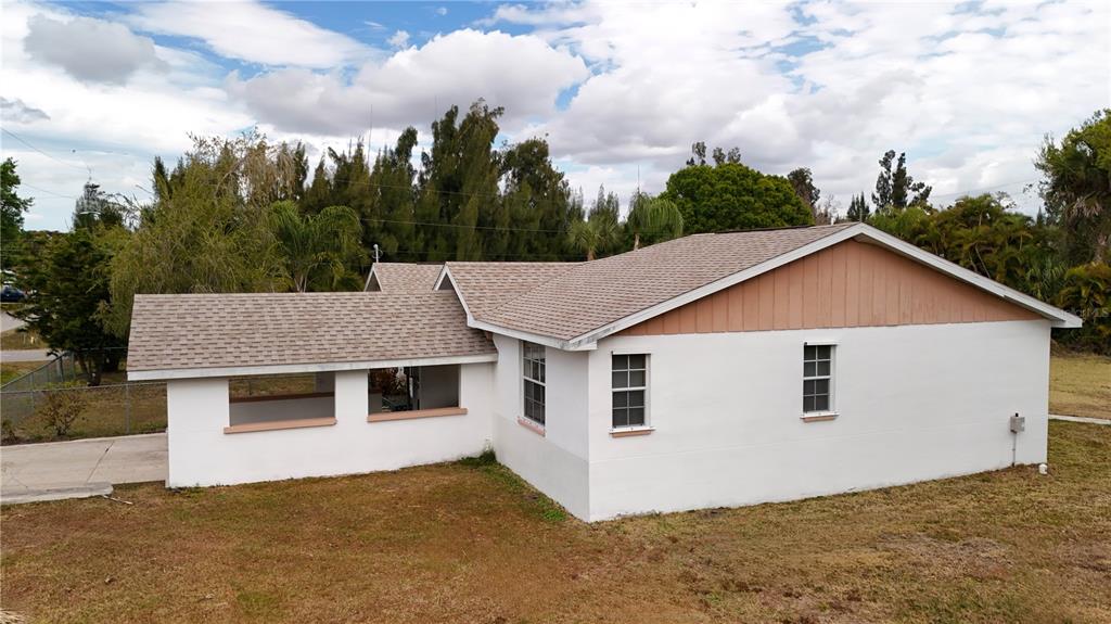 6386 Scott Street Punta Gorda, FL 33950 - Photo 19 of 40 a view of a house with a backyard