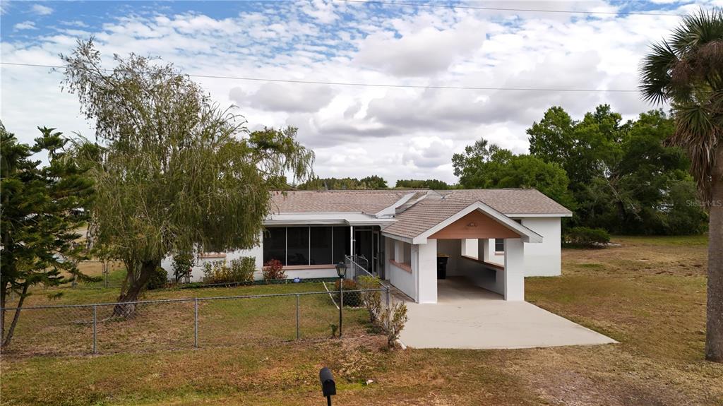6386 Scott Street Punta Gorda, FL 33950 - Photo 2 of 40 a view of a house with a yard