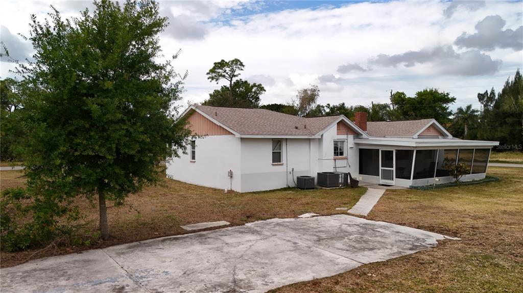 6386 Scott Street Punta Gorda, FL 33950 - Photo 22 of 40 a front view of a house with a garden