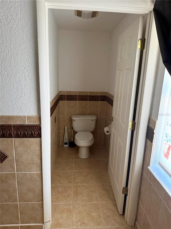 6386 Scott Street Punta Gorda, FL 33950 - Photo 27 of 40 a bathroom with a toilet and a shower