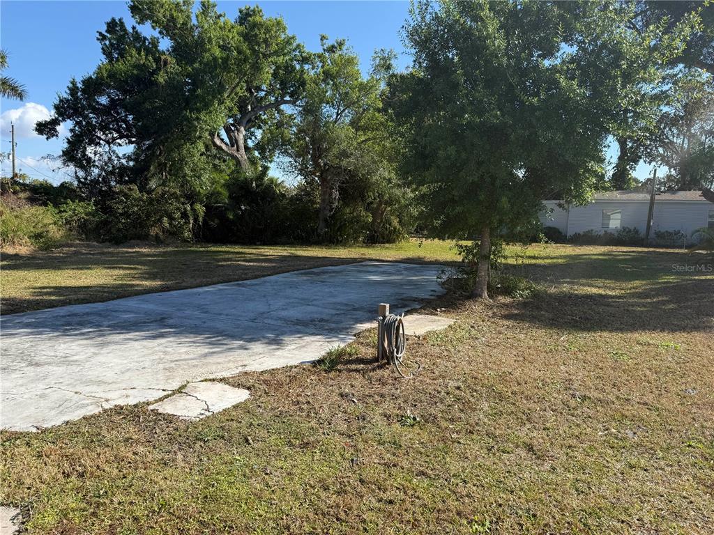6386 Scott Street Punta Gorda, FL 33950 - Photo 39 of 40 a view of a yard with an outdoor space