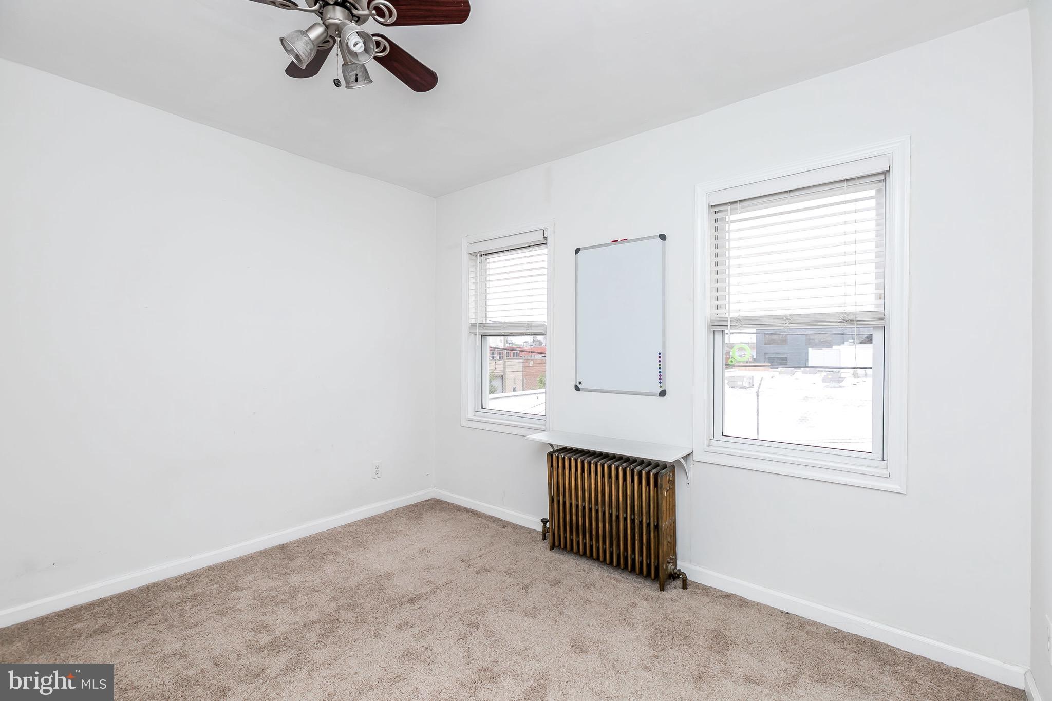 1315 Webster Street Baltimore, MD 21230 - Photo 27 of 29 a view of an empty room with a window