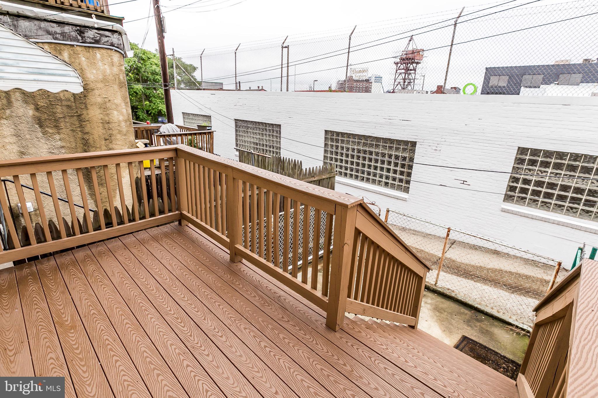 1315 Webster Street Baltimore, MD 21230 - Photo 29 of 29 a view of a balcony with wooden floor
