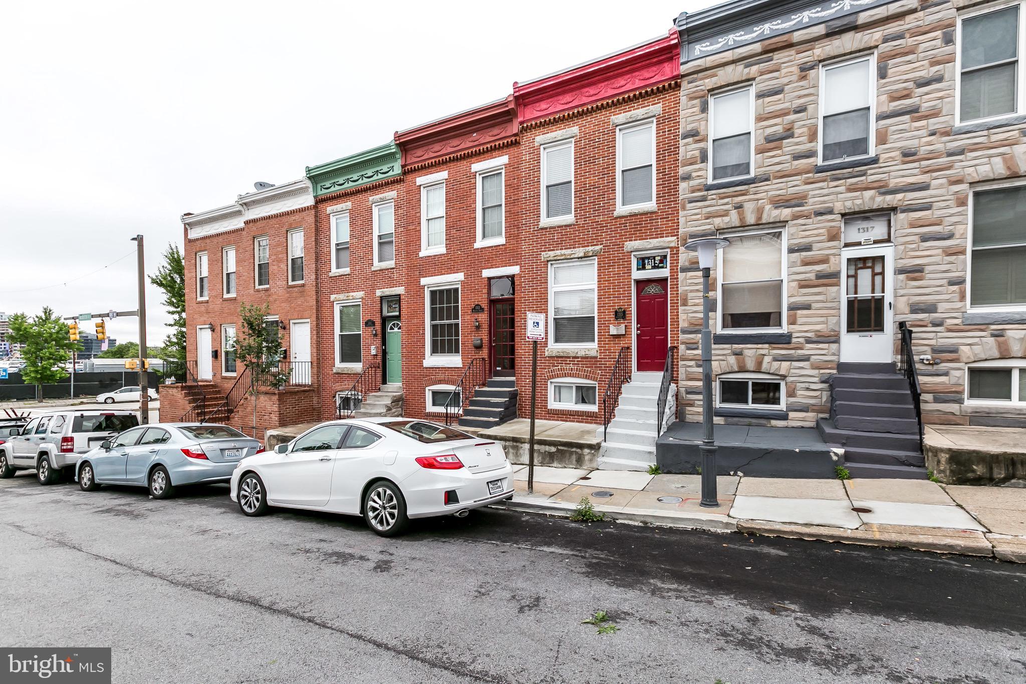 1315 Webster Street Baltimore, MD 21230 - Photo 3 of 29 a view of a cars park in front of a building
