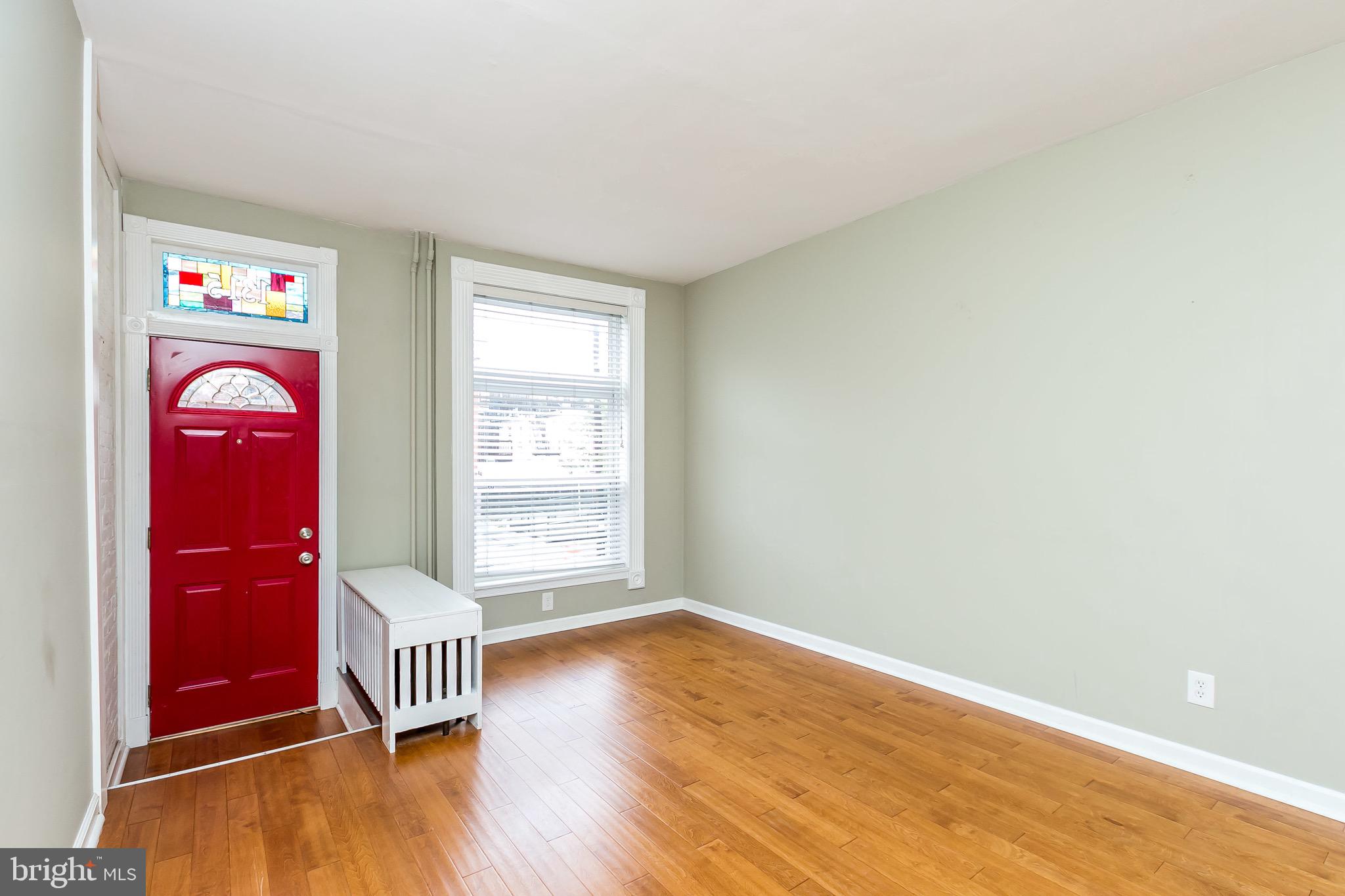 1315 Webster Street Baltimore, MD 21230 - Photo 6 of 29 a view of empty room with wooden floor and fan