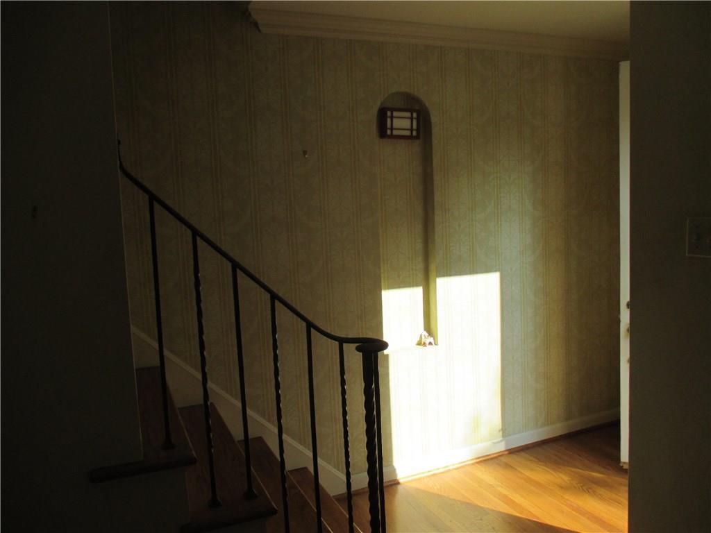 Stairway to the 2nd floor, quest closet and front door