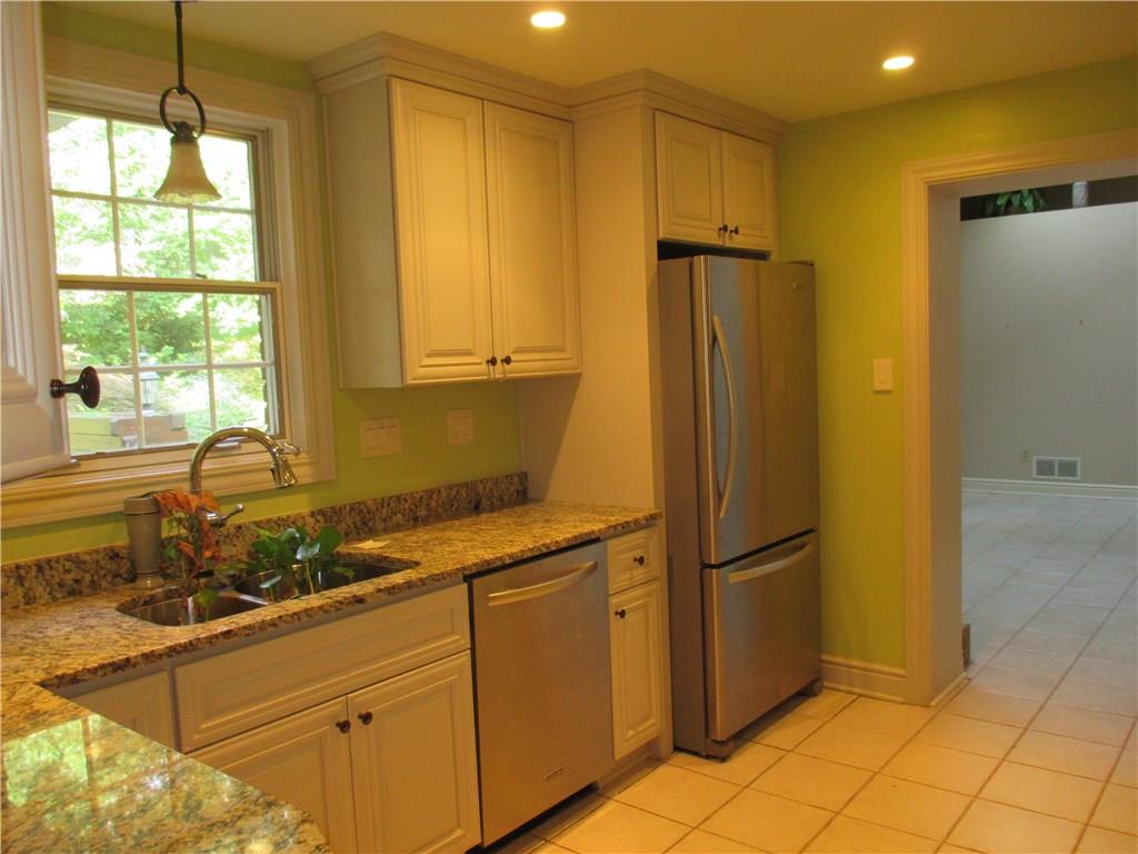 278 Sleepy Hollow Road Pittsburgh, PA 15228 - Photo 10 of 23 Kitchen with granite counters, recessed lighting appliances view of the rear yard and connects to the "den" or extended kitchen