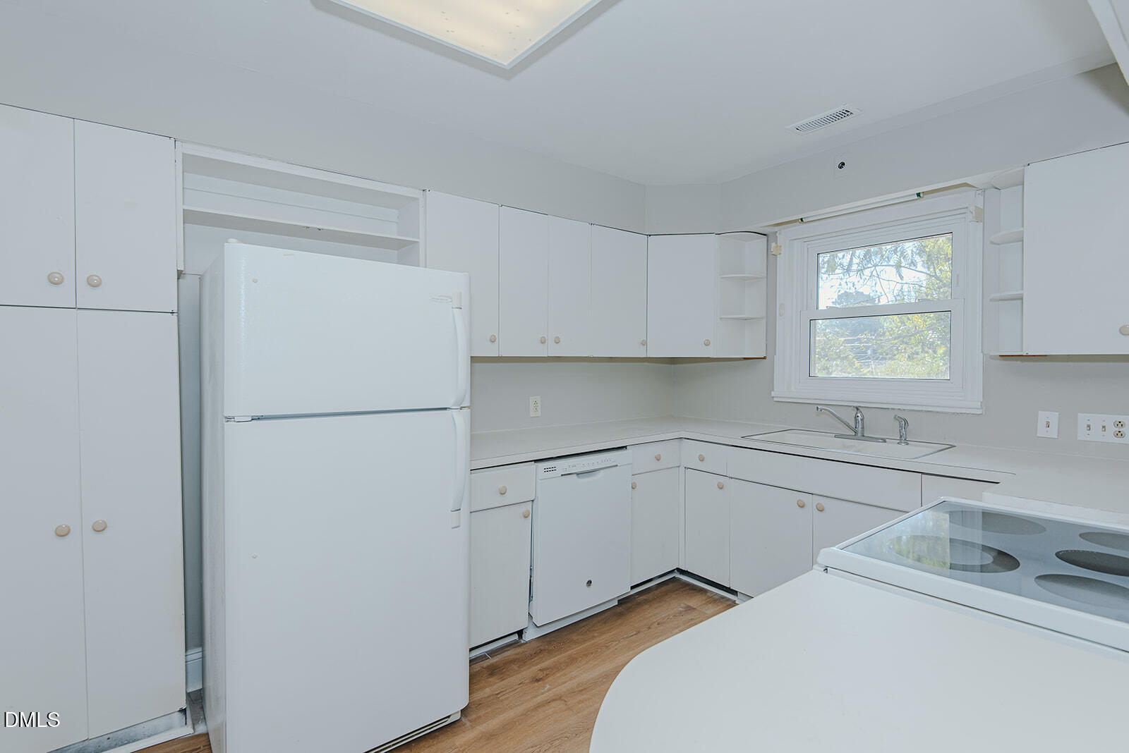 408 Ward Street Graham, NC 27253 - Photo 11 of 21 a kitchen with a refrigerator sink and cabinets