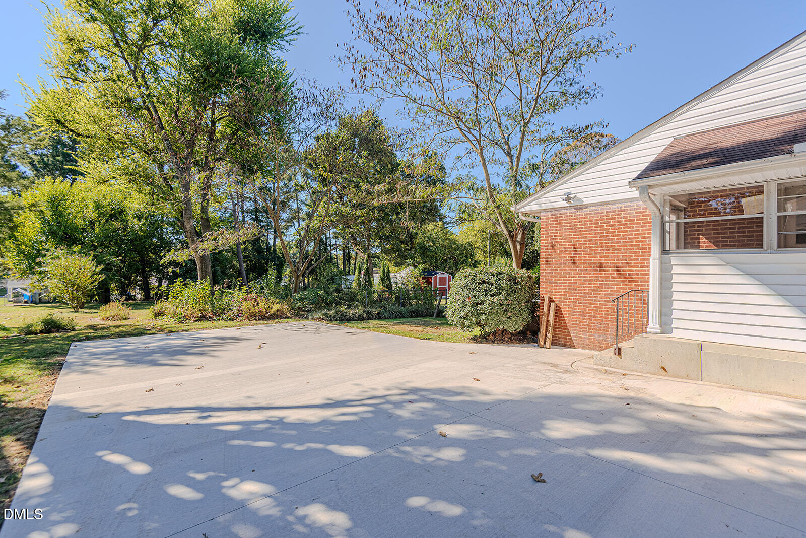 408 Ward Street Graham, NC 27253 - Photo 15 of 21 a view of a backyard with a tree