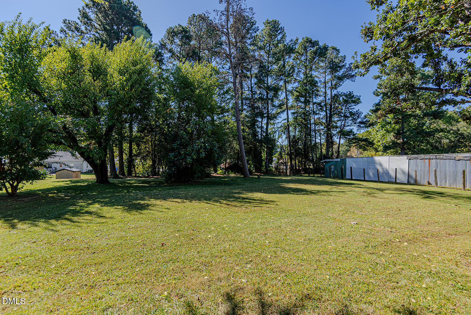 408 Ward Street Graham, NC 27253 - Photo 18 of 21 a view of swimming pool and trees in the background