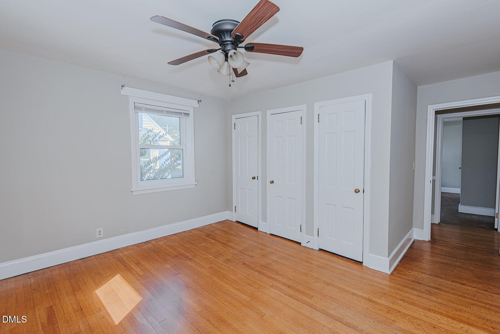 408 Ward Street Graham, NC 27253 - Photo 7 of 21 a view of a big room with wooden floor and a chandelier fan