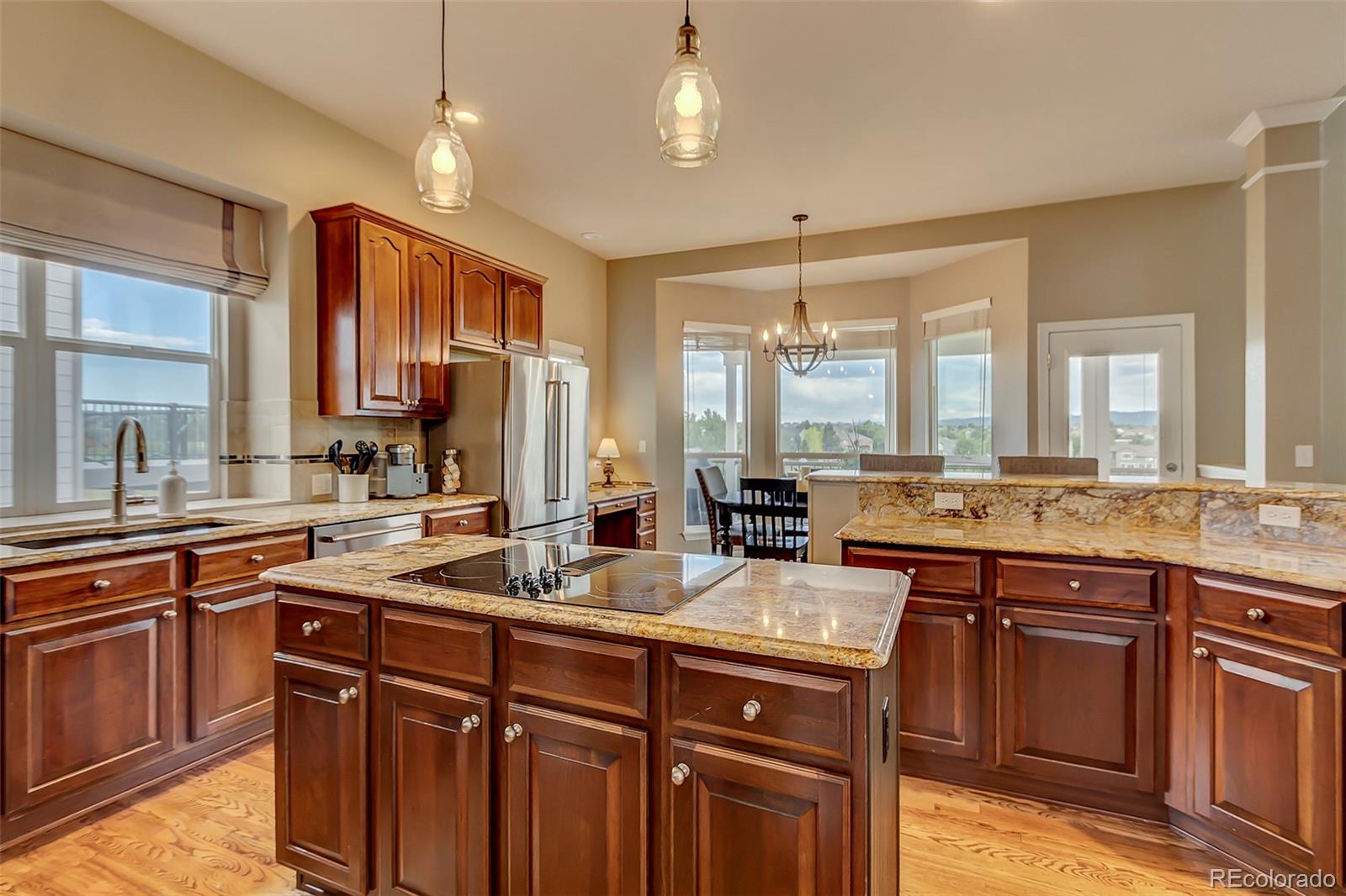 456 West Angus Way Highlands Ranch, CO 80129 - Photo 13 of 40 a kitchen with lots of counter space and a sink