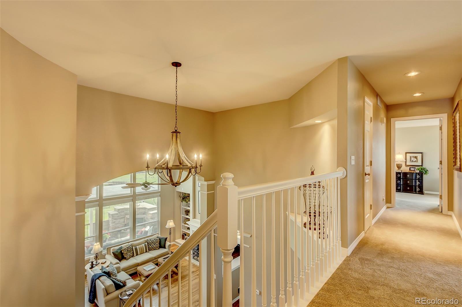 456 West Angus Way Highlands Ranch, CO 80129 - Photo 17 of 40 a view of a hallway with a chandelier