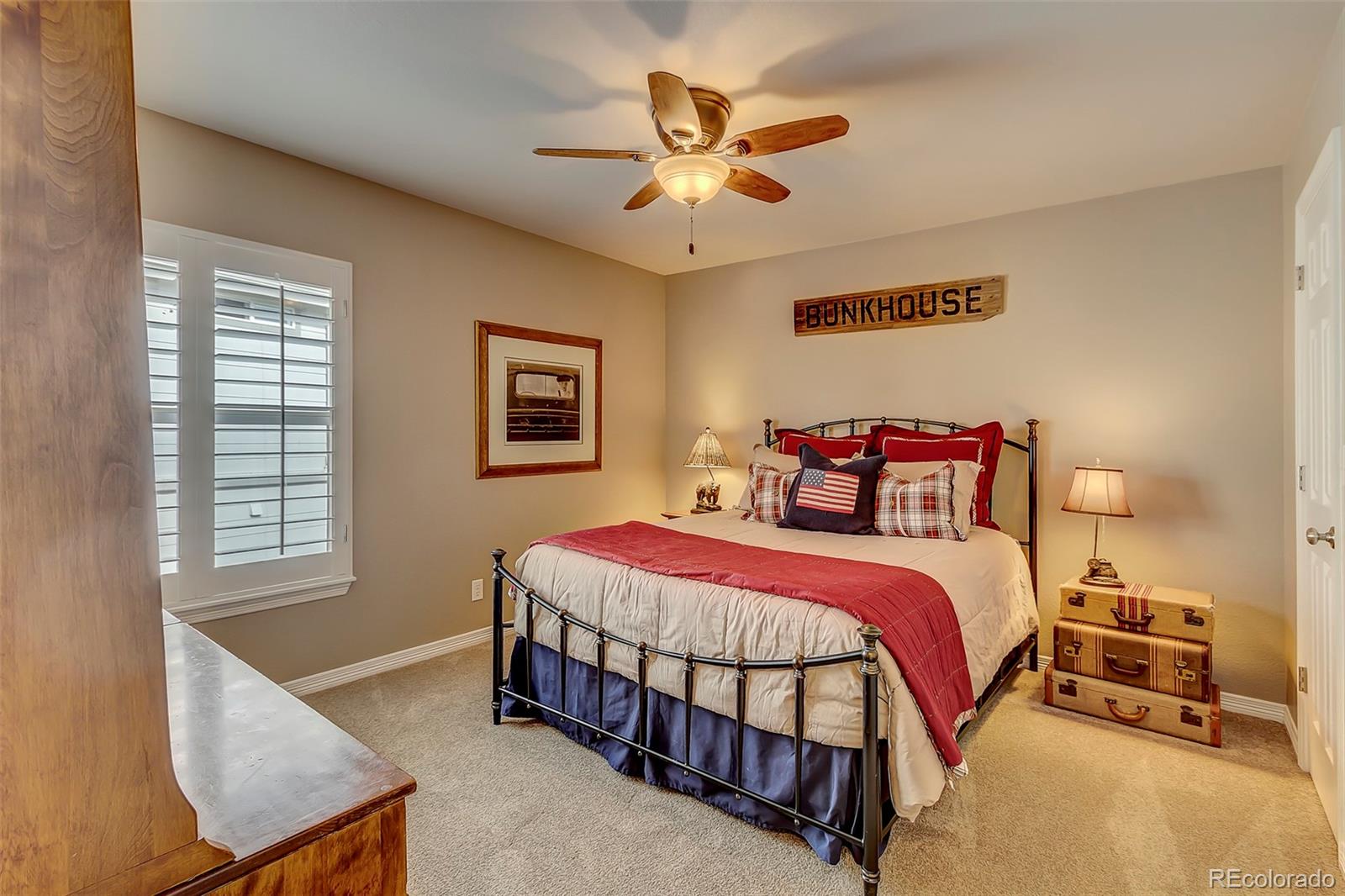 456 West Angus Way Highlands Ranch, CO 80129 - Photo 20 of 40 a bedroom with a bed and a chandelier