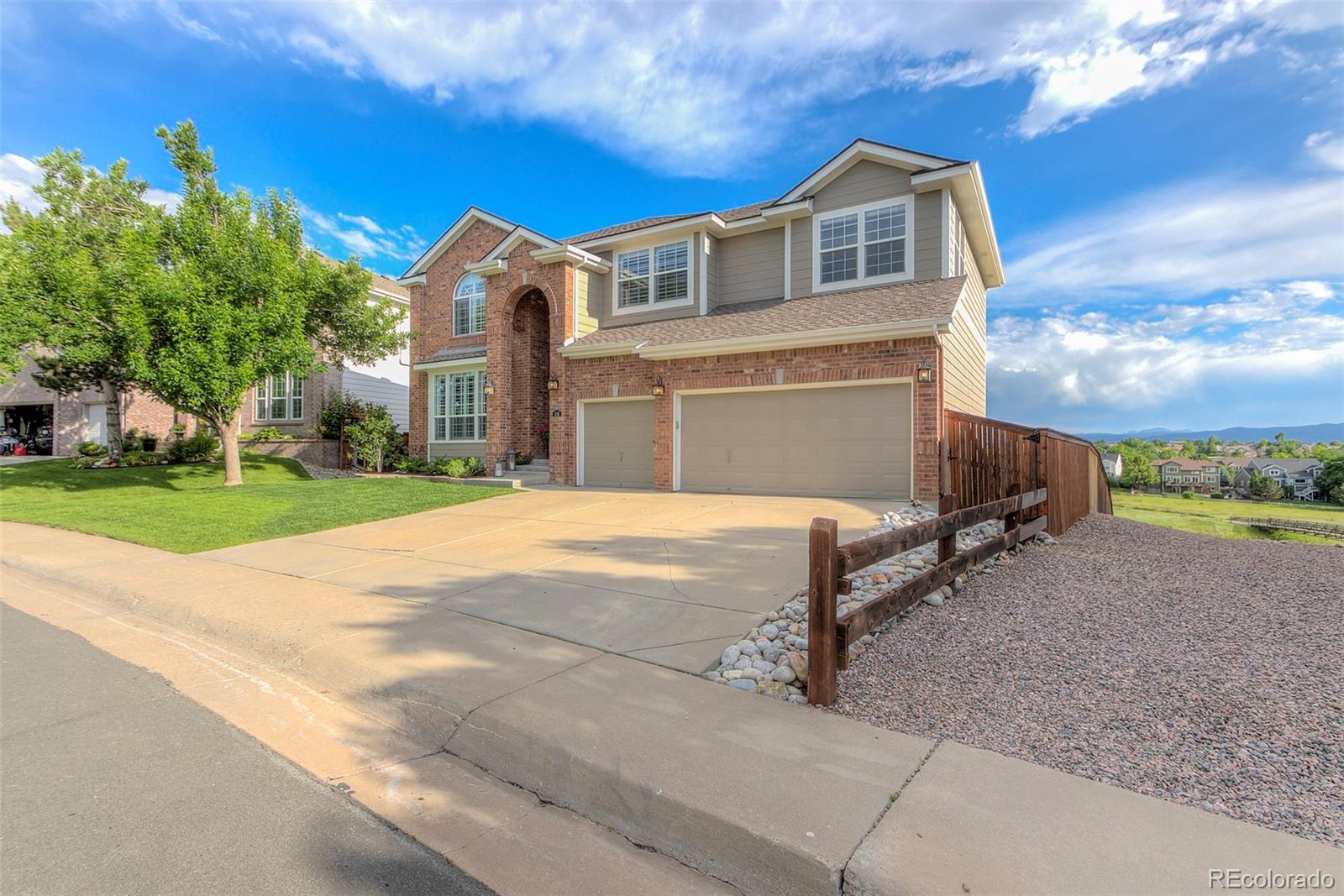 456 West Angus Way Highlands Ranch, CO 80129 - Photo 2 of 40 a front view of a house with a yard