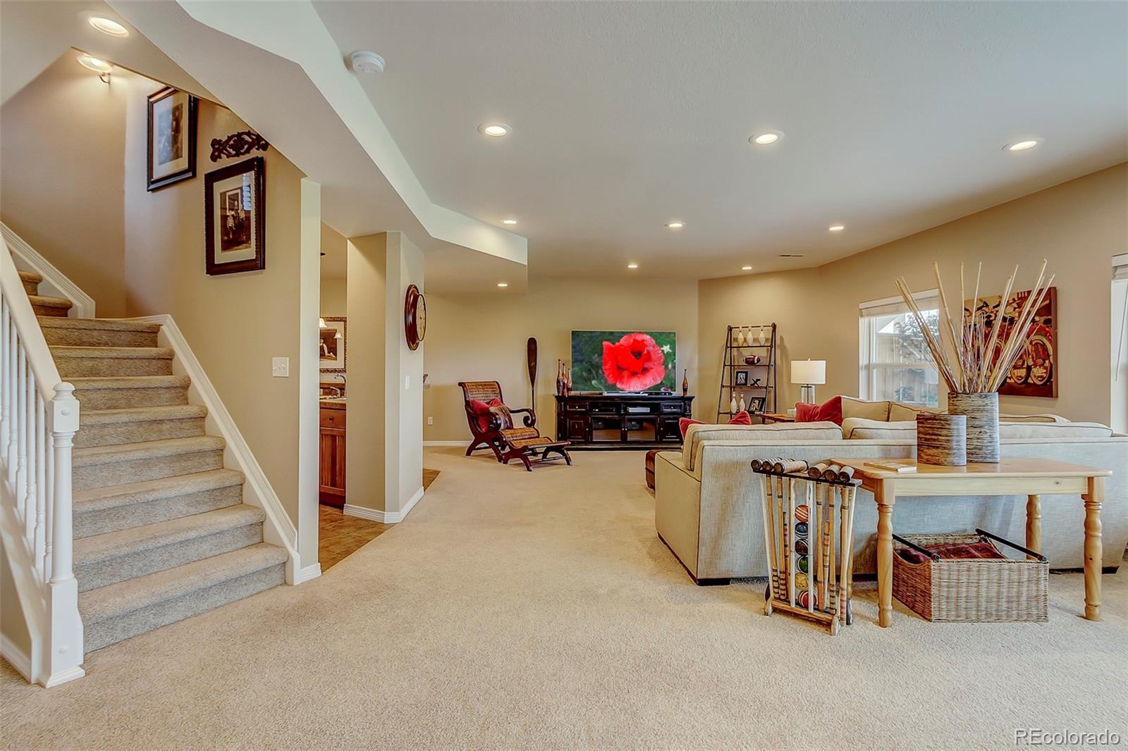 456 West Angus Way Highlands Ranch, CO 80129 - Photo 27 of 40 a view of a livingroom with furniture and stairs
