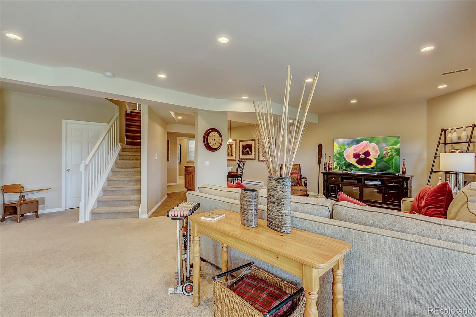 456 West Angus Way Highlands Ranch, CO 80129 - Photo 28 of 40 an outdoor living room with furniture and a flat screen tv
