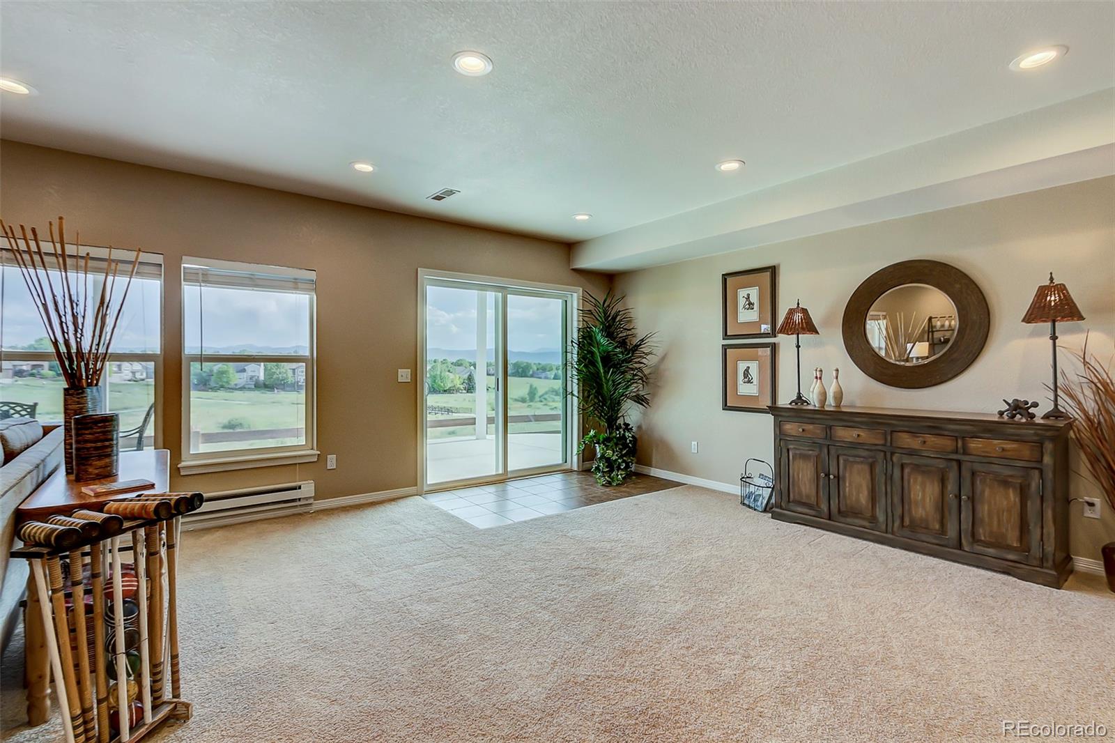 456 West Angus Way Highlands Ranch, CO 80129 - Photo 29 of 40 a view of a livingroom with furniture and a large window