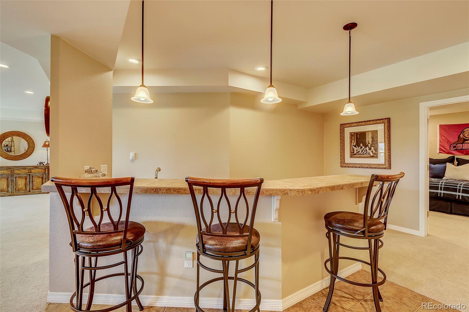 456 West Angus Way Highlands Ranch, CO 80129 - Photo 30 of 40 a view of a dining room with furniture and chandelier