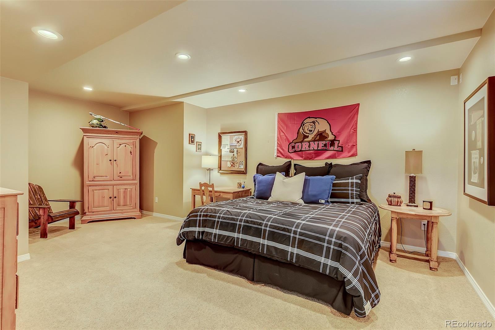 456 West Angus Way Highlands Ranch, CO 80129 - Photo 32 of 40 a bedroom with a bed and lamp