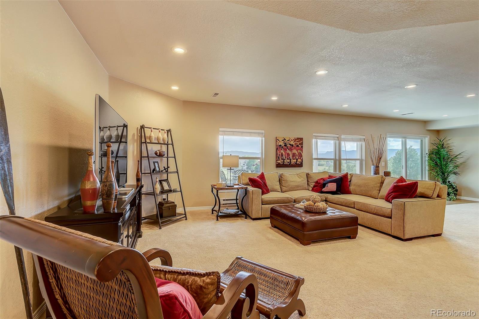 456 West Angus Way Highlands Ranch, CO 80129 - Photo 33 of 40 a living room with furniture and gym equipment