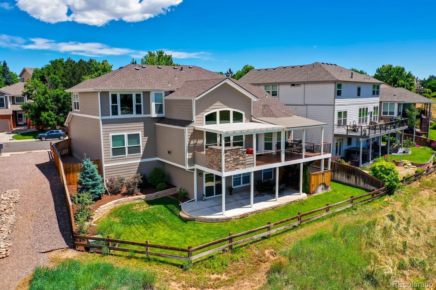 456 West Angus Way Highlands Ranch, CO 80129 - Photo 40 of 40 a view of a house with backyard porch and sitting area