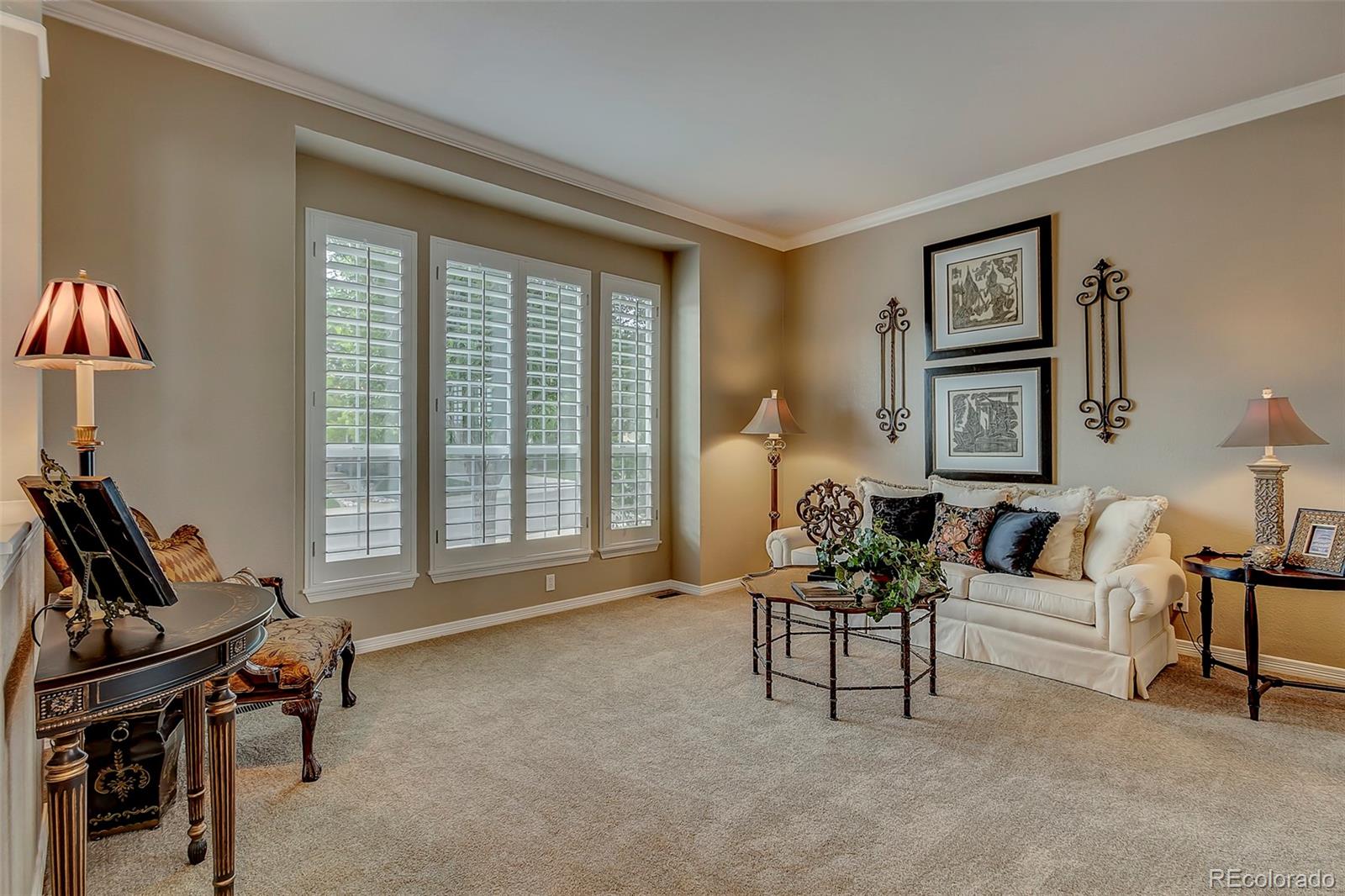 456 West Angus Way Highlands Ranch, CO 80129 - Photo 4 of 40 a living room with furniture and a large window