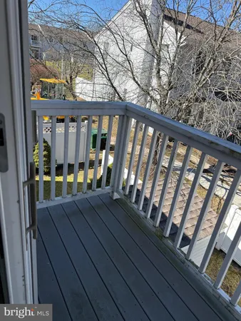a view of balcony with wooden floor