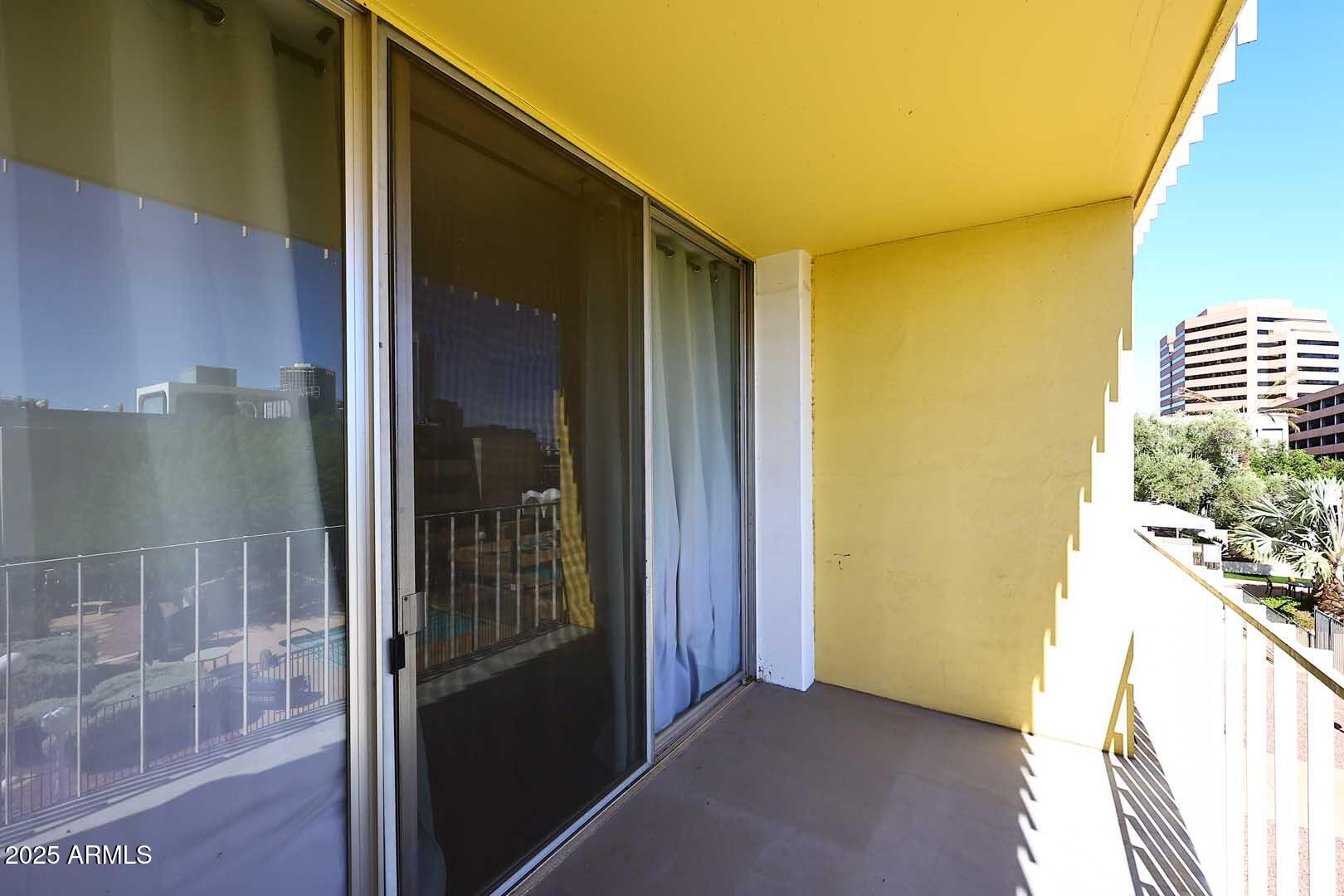 207 West Clarendon Avenue, Unit 2A Phoenix, AZ 85013 - Photo 12 of 36 Primary Bedroom-Balcony
