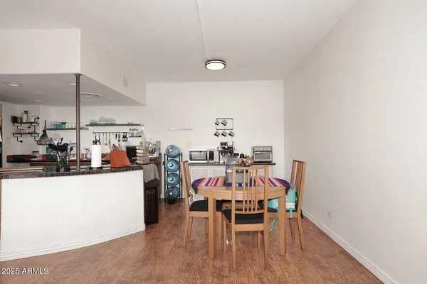 a view of a dining room with furniture and wooden floor
