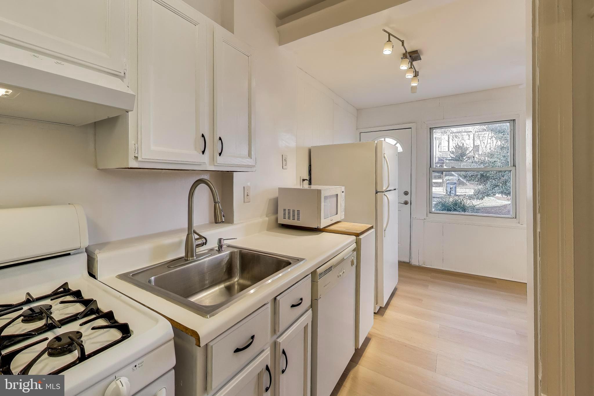 743 Hamilton Street Northwest Washington, DC 20011 - Photo 11 of 43 Opening to sunroom and stair to backyard.