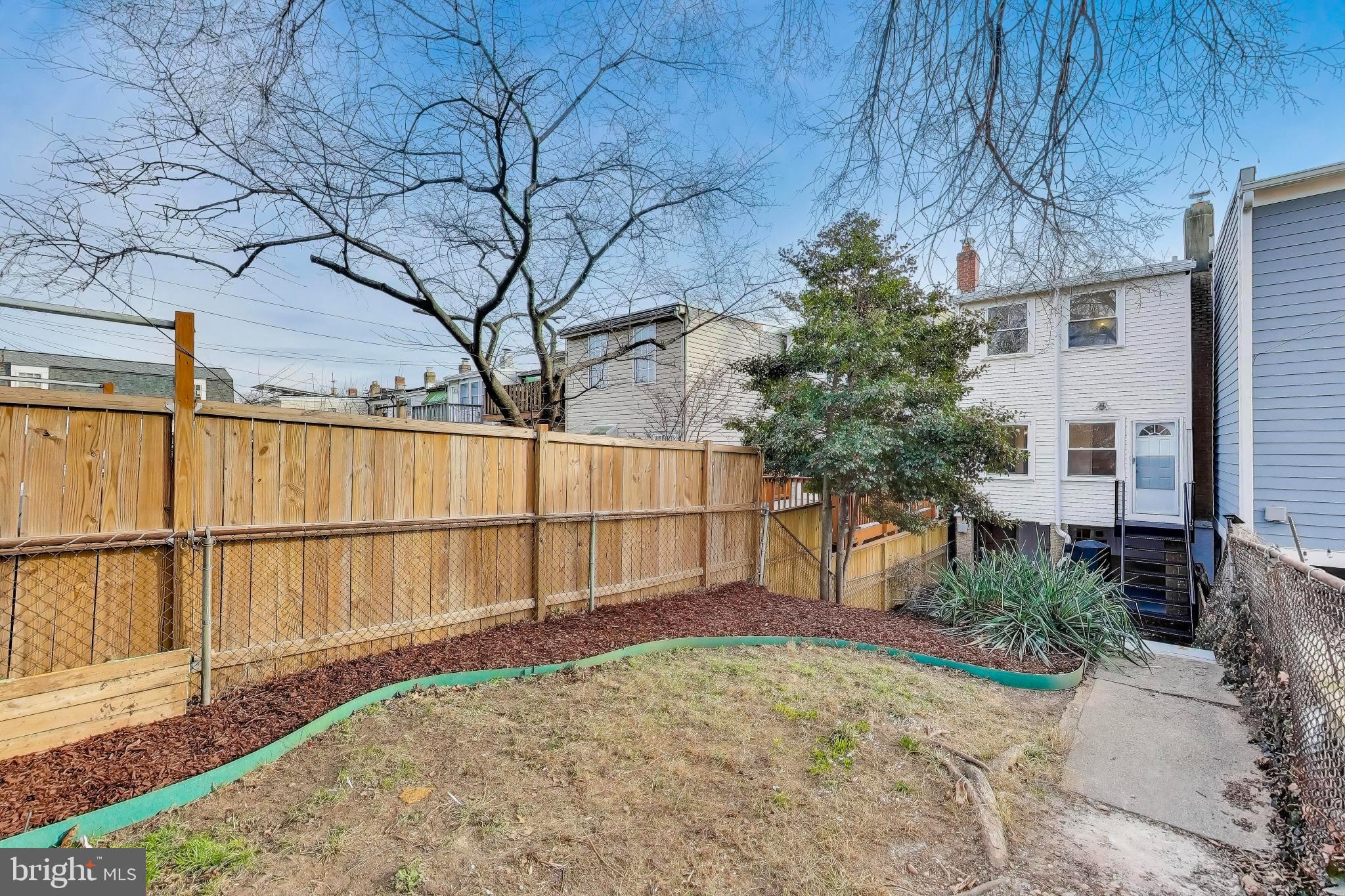 743 Hamilton Street Northwest Washington, DC 20011 - Photo 38 of 43 A gardener's oasis - edge beds and wooden fencing.